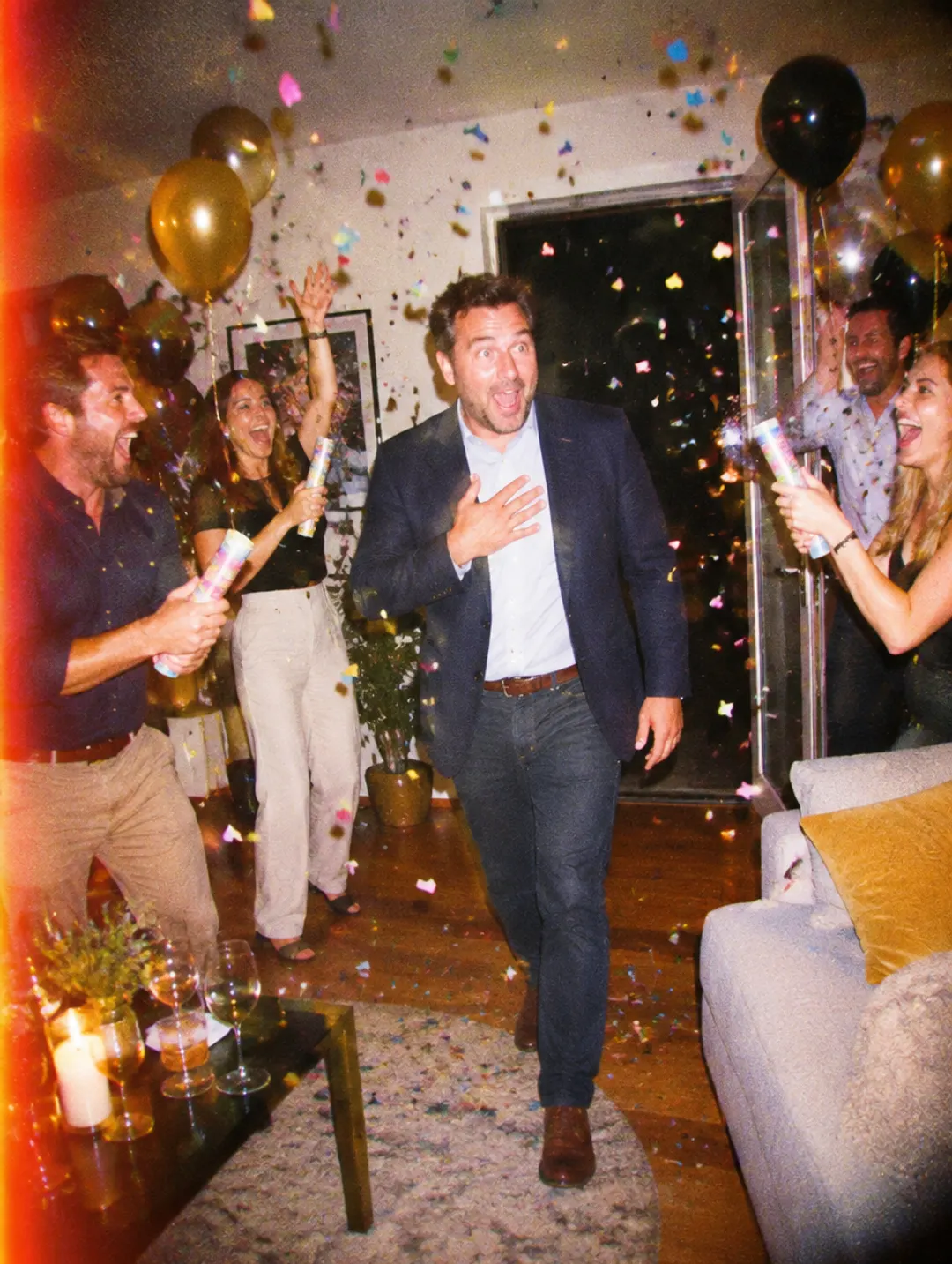 Friends surprising a man at his 40th birthday