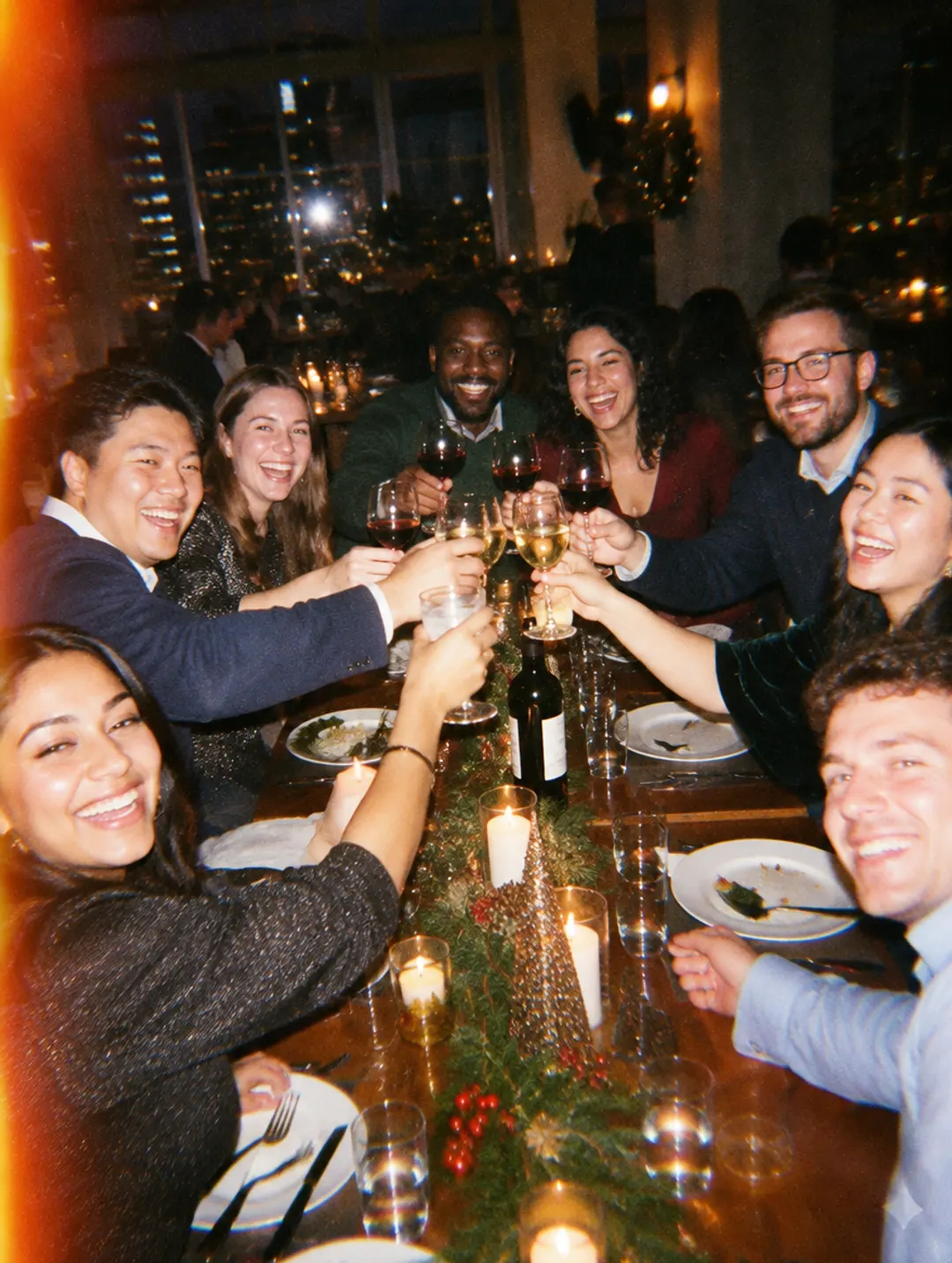 Team toasting at a holiday party dinner