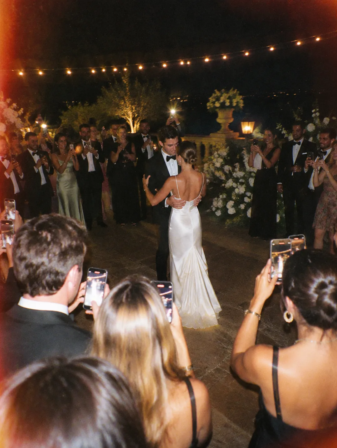 Guests filming the first dance